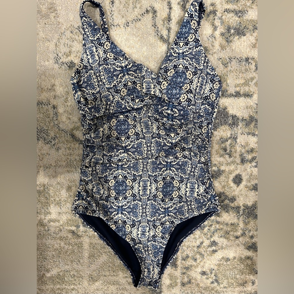 Nip tuck one piece swimsuit.